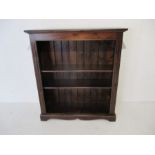 A stained pine freestanding bookcase with two shelves - Length 96.5cm, Height 108cm.