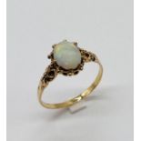 A 9ct gold ring set with an opal