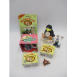 A small collection of Wallace & Gromit items including money box, figurines, mug etc