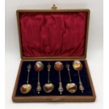 A cased set of hallmarked silver "Soldiers of the Queen" coffee spoons