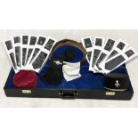 A collection of Masonic regalia including a Knights Templar and Knights of Malta cap, brown