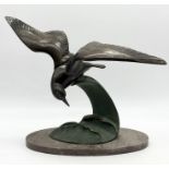 Irenee Rochard - An Art Deco spelter study, circa 1930s, of a seagull in flight over a patinated