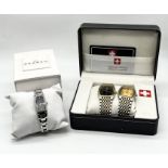 A boxed Skagen ladies watch along with two Montre Suisse watches