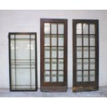 A pair of glazed wooden doors, along with one other, A/F, height 198cm, length 72cm.