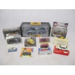 A collection of various boxed die-cast cars and bikes including a Chrono Aston Martin (H1003),