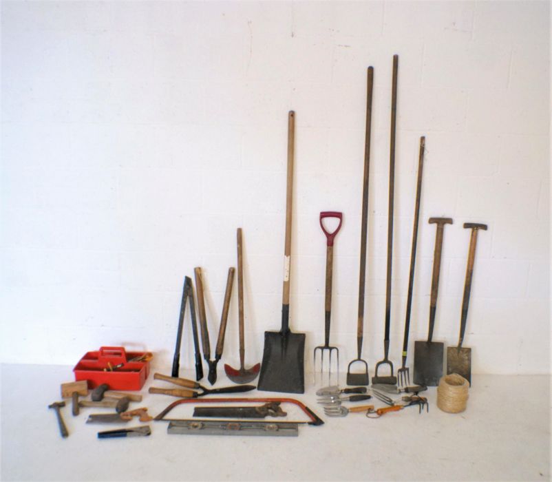 A quantity of various vintage tools and gardening items including shovel, spades, gardeners fork,