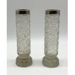 A pair of cut-glass vases with hall marked silver tops - Height 24cm