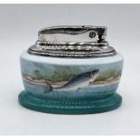 A Minton porcelain cased Ronson table lighter, painted with leaping salmon signed R Scott