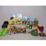 A collection of various Playmobil including vehicles (campervan, quad bikes, boat, car etc),