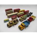 A collection of vintage playworn die-cast buses and trucks including Corgi Toys, Dinky, Lesney etc