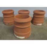 Four terracotta chimney pots (one has damage to base) height 31cm