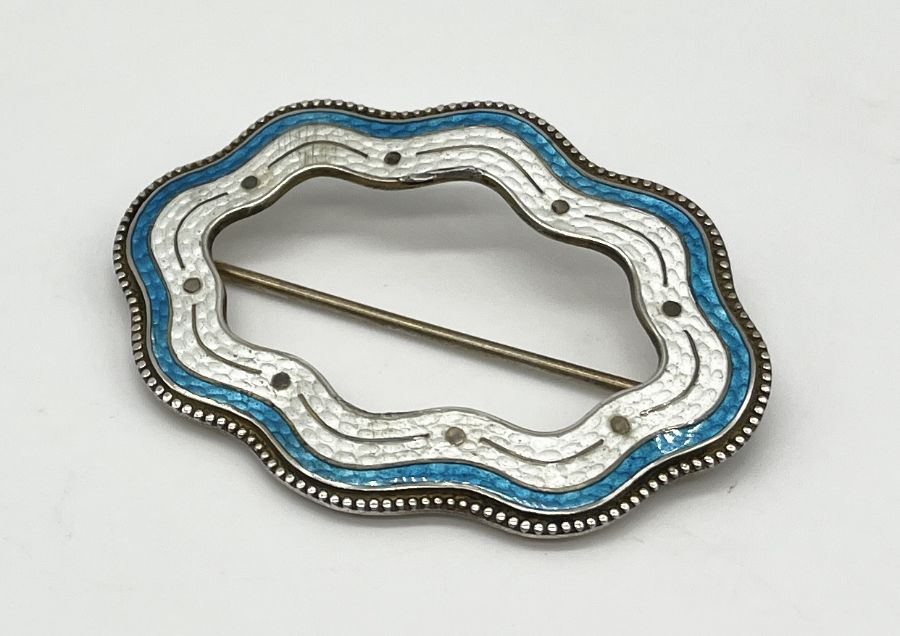 A Sterling silver and enamelled brooch marked RD 1905 to reverse