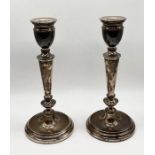 A pair of hallmarked silver candlesticks, height 21cm