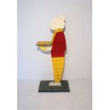 A Rupert the Bear painted display stand.