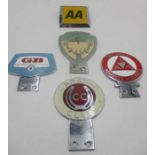 A selection of car and caravan club car badges including AA, Caravan Club, Cheltenham Owners Club,