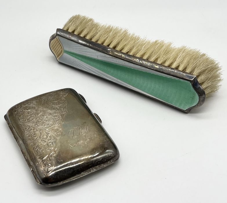 A hallmarked silver cigarette case (53.2g) along with an enamelled silver brush with Art Deco