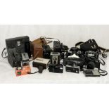 A collection of vintage cameras including Kodak, Minolta etc.