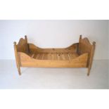 An antique pine single bed frame, length 192cm, width 100cm.