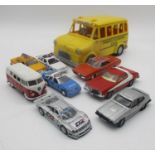 A selection of play worn die cast toys including two N.Y.P.D Police cars, a Corgi Ford Gran Torino