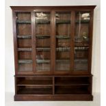 A Victorian library bookcase with four glazed doors and original leather edging - length 170cm,