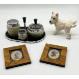A small collection of items including a cast iron terrier door stop, two miniature portraits and a