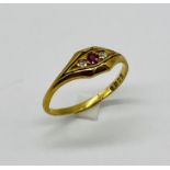 A Victorian 18ct gold ruby and diamond three stone ring
