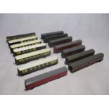 A collection of various OO gauge model railway carriages including Pullman coaches, Post Office