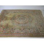 A Chinese beige ground rug. 380cm x 279cm