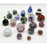 A large collection of glass paperweights including one by Charlie Meaker signed and dates 1984