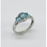 A 9ct white gold topaz and diamond dress ring