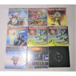 A collection of nine Iron Maiden 7" vinyl records.