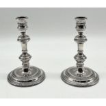 A pair of hallmarked silver Georgian style candlesticks engraved "Presented to W.O.1. T Styles, R.E.