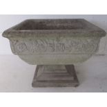 A reconstituted stone planter. height 42cm