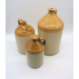 Three stoneware flagons, one marked 'Wheelers, Wycombe' and another marked 'John Leadbetter, Wine