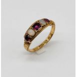 A Victorian 15ct gold five stone ring set with amethysts and opals