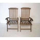 Two wooden folding garden steamer chairs, marked 'Danish Scancraft Design'.