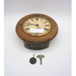 A circular oak cased 30 hour wall clock.