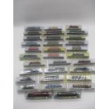 A collection of Del Prado N gauge locomotive models on plinths in original packaging, mainly