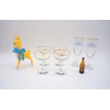 Four Babycham glasses along with a Babycham deer figure, a pair of Goldwell Snowball glasses and a
