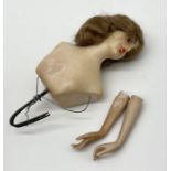 An early 20th century boudoir style wax doll's head with two loose porcelain arms