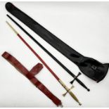 Two ceremonial Masonic swords with scabbards in black and red, one with red leather frog and the