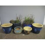 Six glazed garden pots.