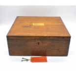 An oak cutlery box with campaign handles.