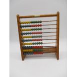 A vintage wooden Kiddicraft abacus - height 31cm