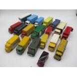 A collection of playworn die-cast vans and trucks including Dinky Toys, Corgi Toys, Lledo