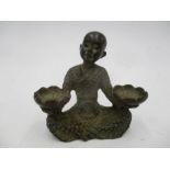 A small bronze figure of a seated Buddhistic monk
