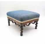 A Victorian upholstered footstool, on barley twist legs.