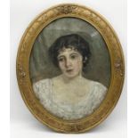 An early 20th century oil on canvas showing a young woman in oval gilt frame 62cm x 53cm