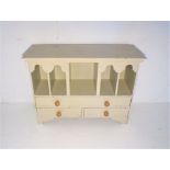 A small painted set of drawers, length 60.5cm, height 45cm.