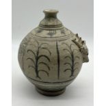 An Oriental pottery vessel with blue and white painted detail and raised deer mask motif to side -